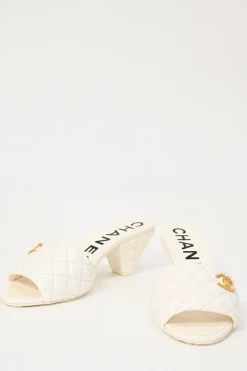 White matelassé goatskin leather and rubber cone heel slide sandals with gold-finish Coco Mark vamp appliqué