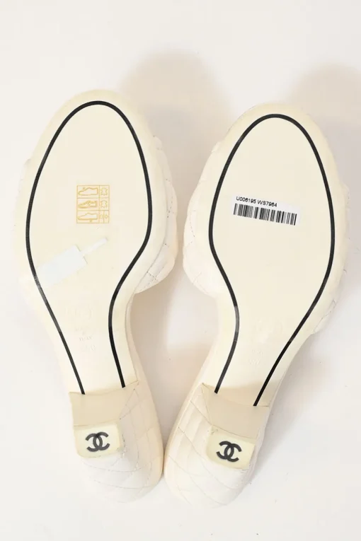 White matelassé goatskin leather and rubber cone heel slide sandals with gold-finish Coco Mark vamp appliqué
