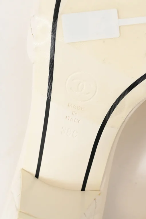 White matelassé goatskin leather and rubber cone heel slide sandals with gold-finish Coco Mark vamp appliqué