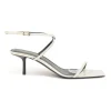 White patent leather low-heeled strappy sandals with criss-cross buckle strap fastening