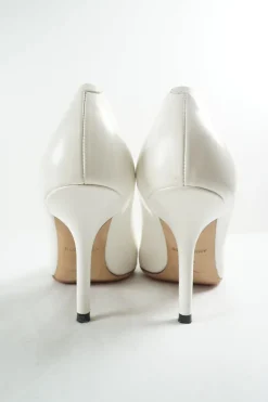 White polished calfskin pointed toe pumps with contrast bandage-style cap toe