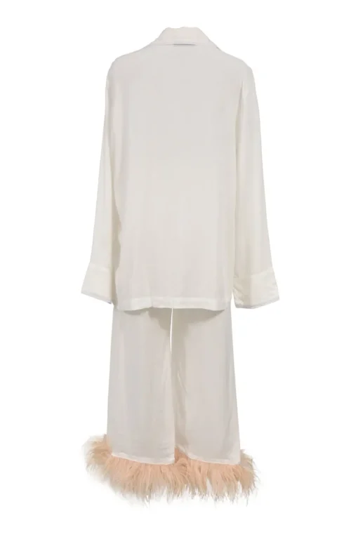 White viscose pyjama two-piece set featuring notch collar blouse and wide-leg lounge pants with detachable feather trim appliqué