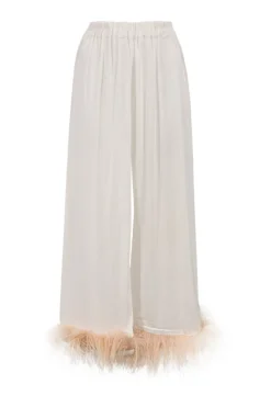 White viscose pyjama two-piece set featuring notch collar blouse and wide-leg lounge pants with detachable feather trim appliqué