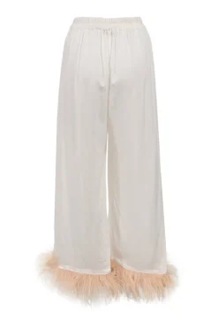 White viscose pyjama two-piece set featuring notch collar blouse and wide-leg lounge pants with detachable feather trim appliqué