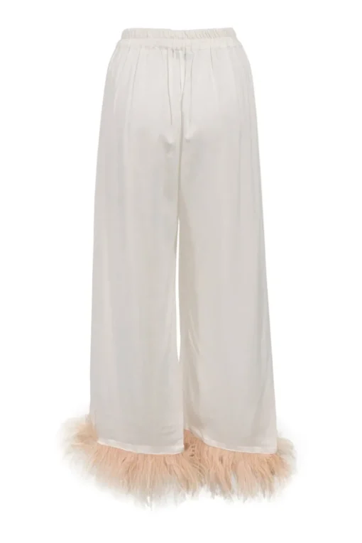 White viscose pyjama two-piece set featuring notch collar blouse and wide-leg lounge pants with detachable feather trim appliqué