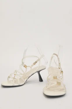 White woven leather cord Louise slingback sandals with gold-tone hardware and comma heels