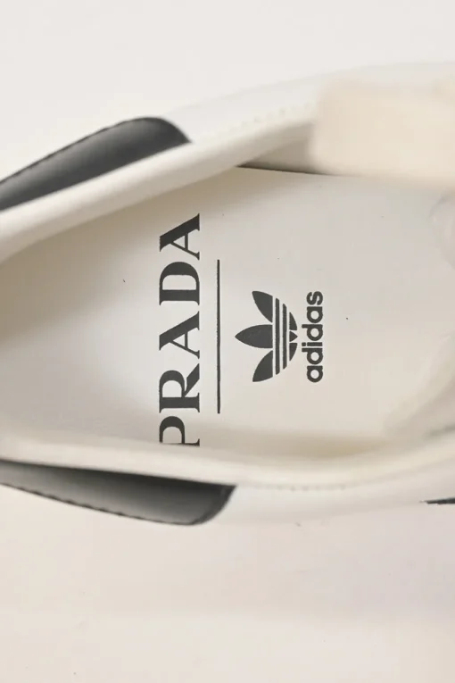 x Adidas white leather Superstar low-top sneakers