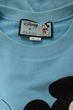 x Disney blue screen-printed cotton French terry crewneck hoodie featuring Mickey Mouse logo motif