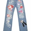 x Disney distressed indigo cotton denim high-rise straight leg LNY jeans featuring Oswald &amp; Ortensia novelty patch appliqué