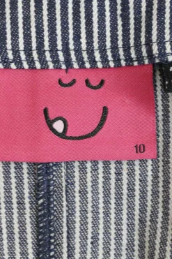 x Mr. Men Mr. Happy embroidered striped indigo cotton-blend denim button-front jumpsuit