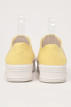 Yellow canvas and leather Jane low-top flatform sneakers featuring signature Triomphe quarter appliqué