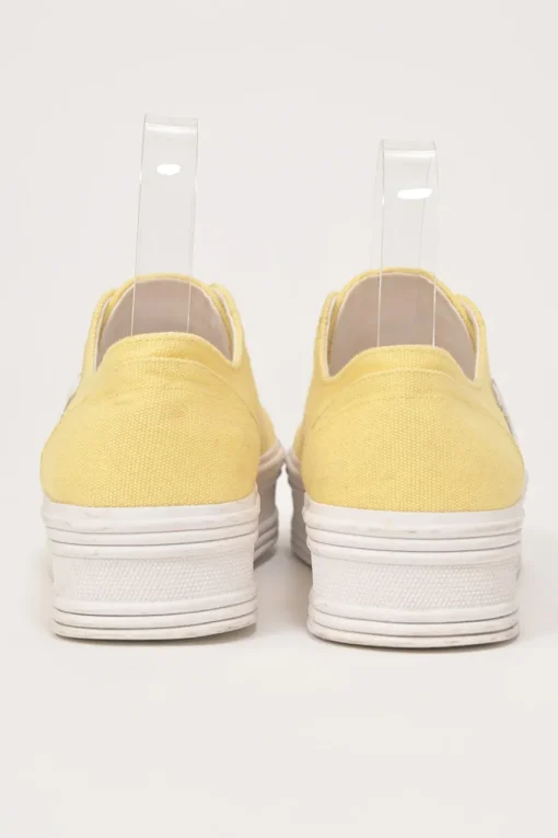 Yellow canvas and leather Jane low-top flatform sneakers featuring signature Triomphe quarter appliqué