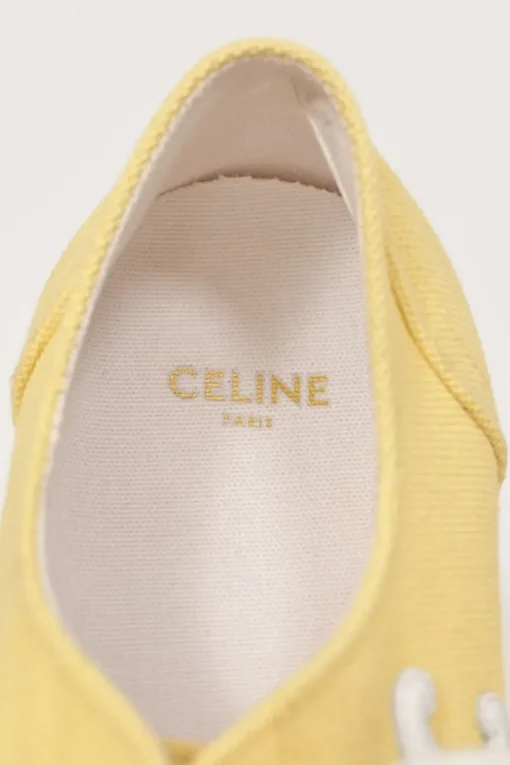 Yellow canvas and leather Jane low-top flatform sneakers featuring signature Triomphe quarter appliqué
