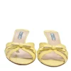 Yellow leather bow mules with sculpted comma heel