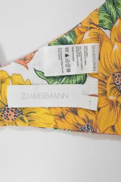 Yellow linen Poppy print two-piece set featuring off-shoulder ruffle bustier top and belted wide-leg pants