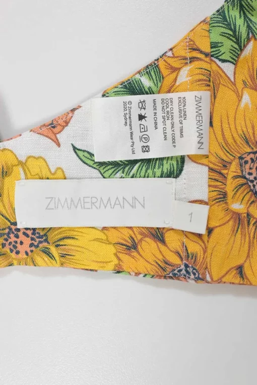 Yellow linen Poppy print two-piece set featuring off-shoulder ruffle bustier top and belted wide-leg pants