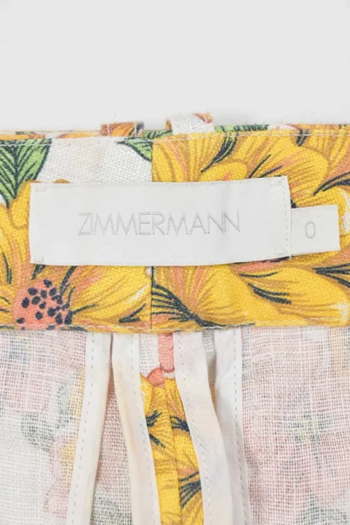 Yellow linen Poppy print two-piece set featuring off-shoulder ruffle bustier top and belted wide-leg pants