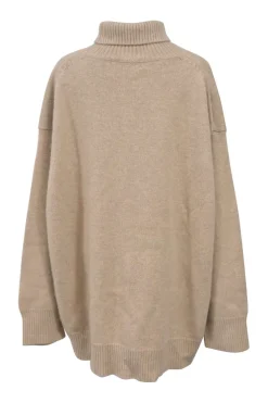 Beige cashmere-blend jersey knit oversized turtleneck pullover sweater with ribbed collar, cuffs, and hem