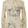 Beige embroidered silk-blend high collar keyhole-front blouse featuring trapeze artist novelty motif