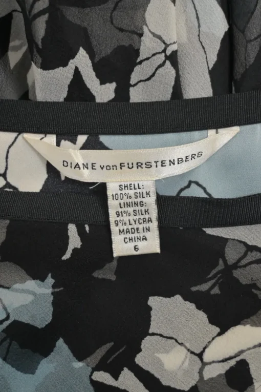 Black and blue silk abstract floral print pull-on mid-rise ruffle mini skirt