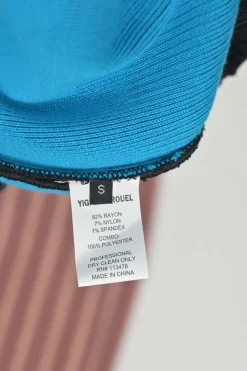 Black and electric blue rayon-blend peek-a-boo knit sheath dress with laser-cut raglan sleeves