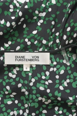 Black and green silk abstract print ruched half-sleeve A-line wrap dress with ruffle hem