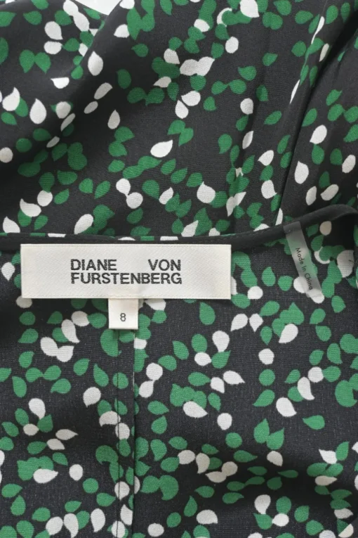Black and green silk abstract print ruched half-sleeve A-line wrap dress with ruffle hem