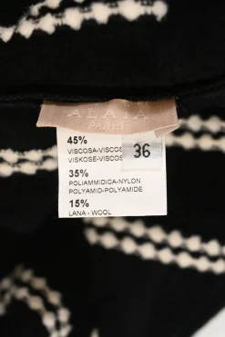 Black and ivory wool-blend intarsia knit crewneck peplum long sleeve top