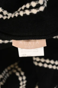 Black and ivory wool-blend intarsia knit crewneck peplum long sleeve top
