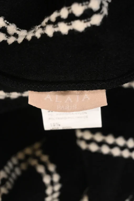 Black and ivory wool-blend intarsia knit crewneck peplum long sleeve top