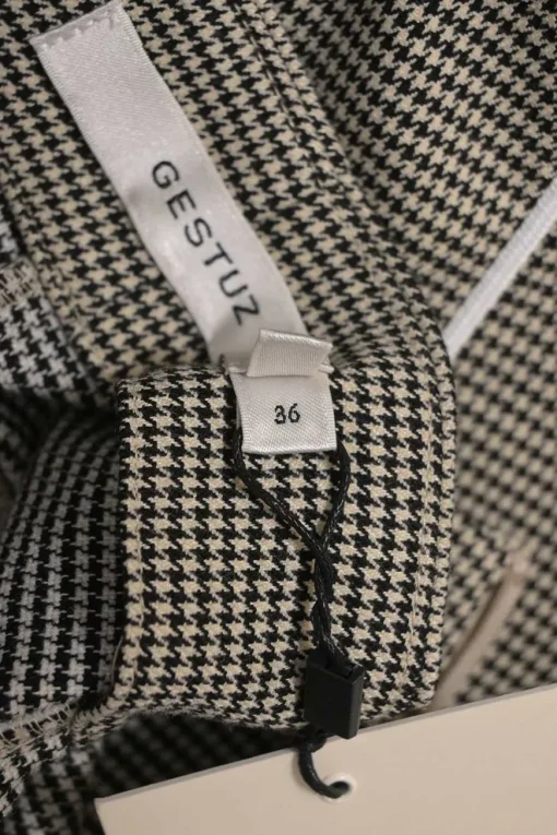 Black and neutral paneled polyester-blend micro houndstooth tweed pencil skirt