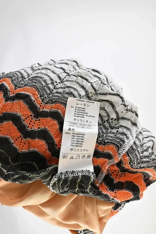 Black and orange polyester-blend scoop neck warp knit pointelle pullover shift dress with flounce hem