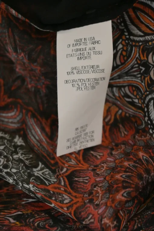 Black and orange semi-sheer viscose sleeveless button-front shirt with floral motif along front panels
