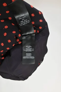 Black and red draped polyester floral-embroidered off-shoulder ruffle top with cascading sash hem