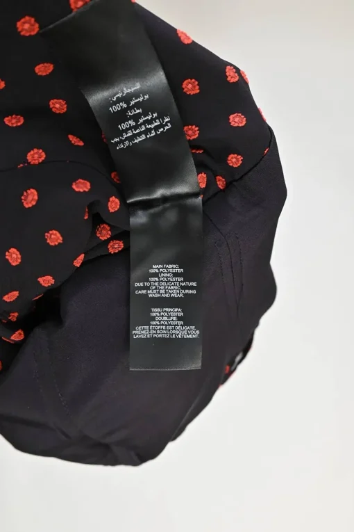 Black and red draped polyester floral-embroidered off-shoulder ruffle top with cascading sash hem