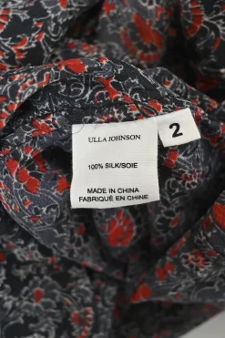 Black and red silk floral print lace-up swing-style tunic top with blouson sleeves