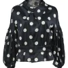 Black and white polka dot polyester satin peak collar blouse with drop shoulders and balloon sleeves