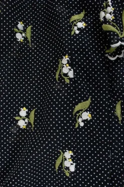 Black and white polkadots sheer sleeveless top with white floral embroideries