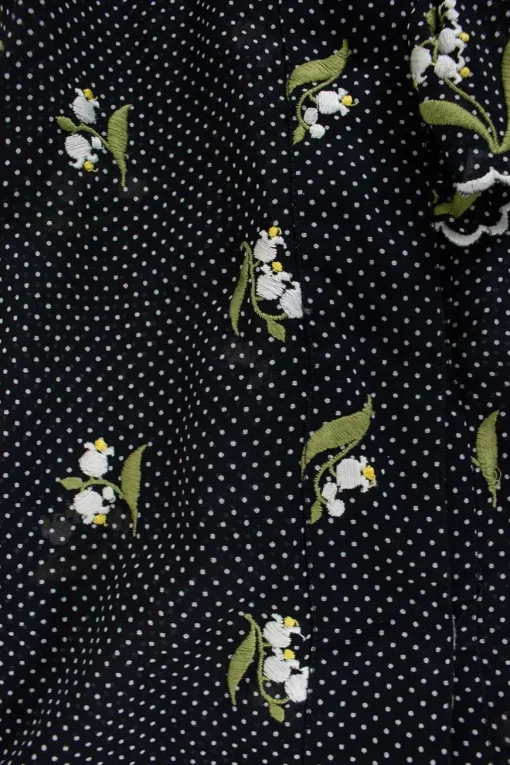 Black and white polkadots sheer sleeveless top with white floral embroideries
