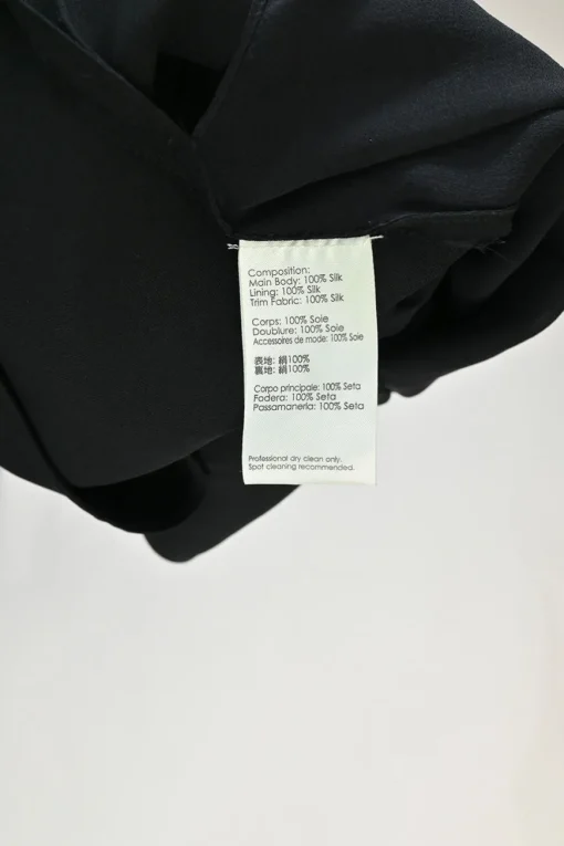 Black beaded silk raglan sleeve shift dress with vented high-low hem