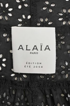 Black bias-cut cotton broderie Anglaise knee-length A-line skirt