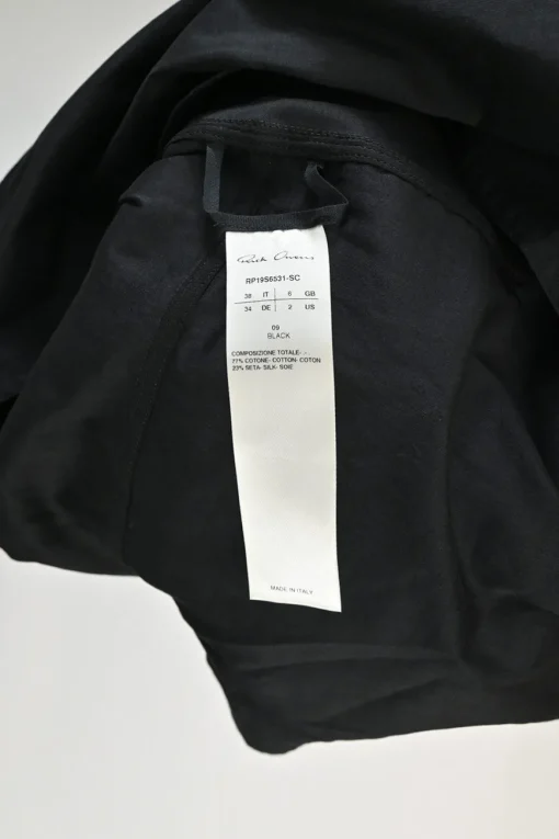 Black bias-cut cotton-silk blend dolman sleeve empire-waist blouse with high-low hem