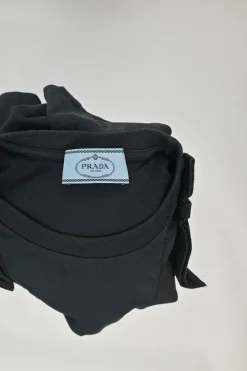 Black bow-embellished paneled crewneck pullover T-shirt