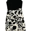 Black brooch-embellished two-tone paneled rayon-blend floral Dobby bateau neck sleeveless sheath dress