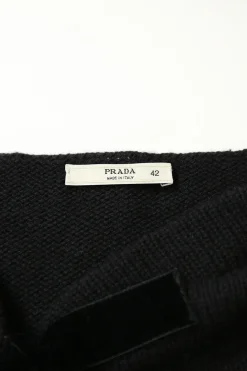 Black cashmere knit bateau neck pullover sweater with tonal velvet bow