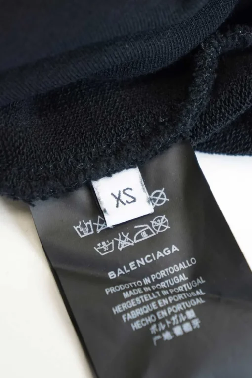 Black cotton French terry small logo hoodie with kangaroo pocket, ribbed cuffs, and hem