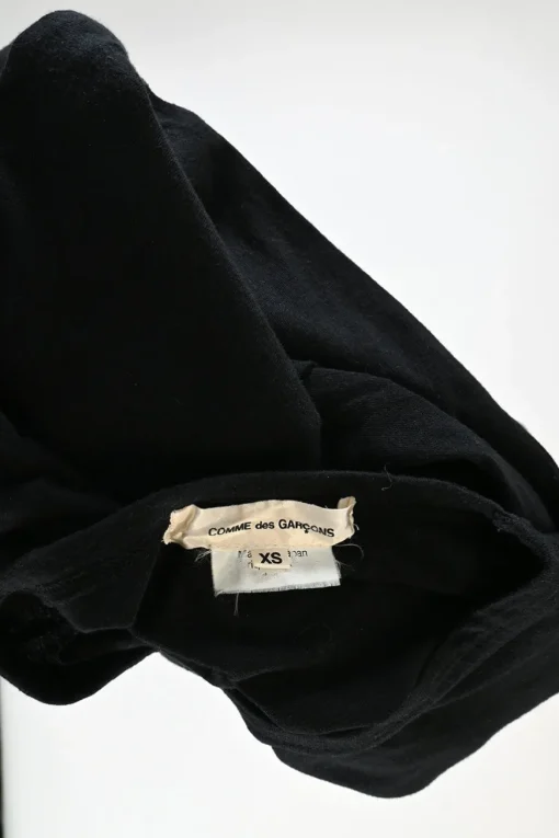Black cotton jersey long sleeve crewneck pullover top with self floral sleeve appliqué
