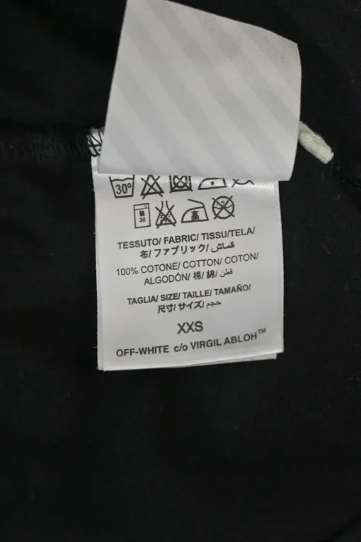 Black cotton jersey pullover T-shirt with spray paint logo at the front and signature diagonal stripe logo printed on the back