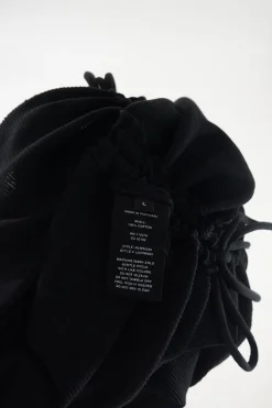 Black cotton micro-rib ruched drawstring lace knit dress with slash shoulders and curved hem
