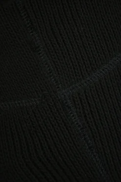Black cotton paneled jersey knit drop-waist bustier mini dress with woven poplin ruffle skirt